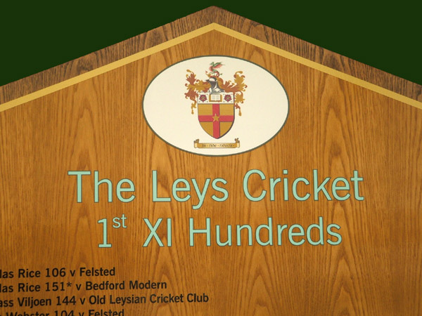 A close up view the Presidents honours board and club logo.