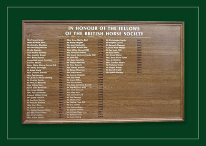 Oak framed honours board listing Fellows of the British Horse Society.