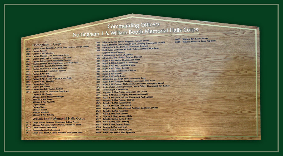 A light oak honours board listing the names of commanding officers of this regional Salvation Army headquarters.