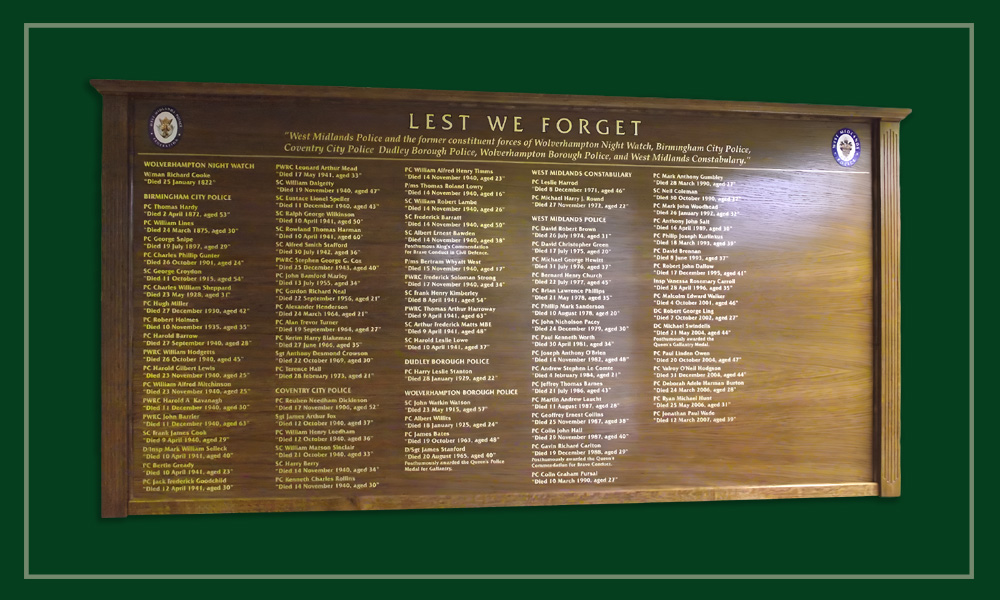 A large oak framed memorial honours board board with fluted columns and moulded capping piece.