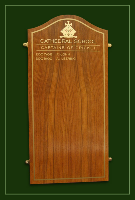 Golden oak honour boards for school sports cricket captains with names in gold.