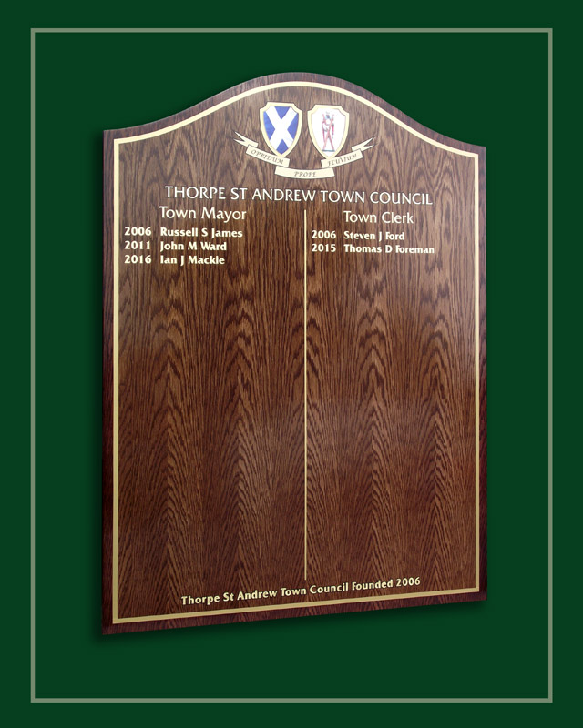 An oak honours board in two shades of woodstain.